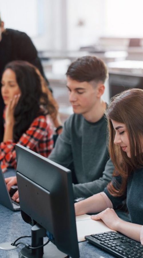 Spacious area. Group of young people in casual clothes working in the modern office